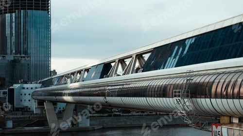 Preview: Modern glass bridge over the river. Futuristic architecture
