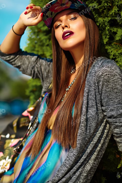 Preview: Portrait of young stylish woman posing outdoors