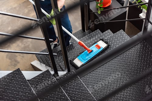 Preview: cropped view of cleaner washing stairs with mop