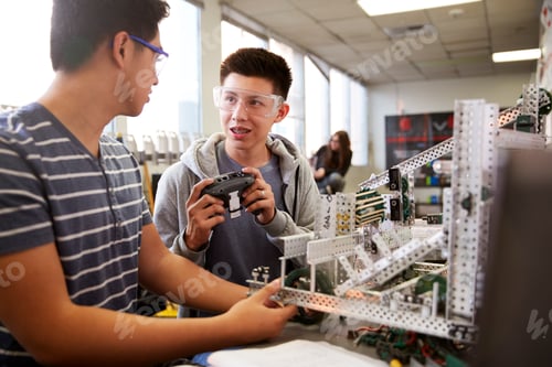 Preview: Two Male College Students Building Machine In Science Robotics Or Engineering Class