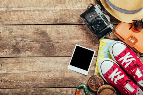 Preview: Set of trip stuff on wooden background