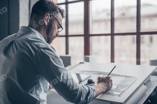 Preview: Working mature man with drawing