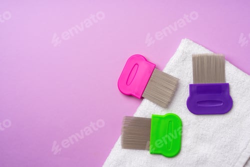 Preview: Anti lice combs and towel on pink background