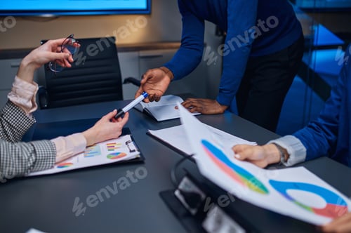 Preview: Managers on business negotiations in night office