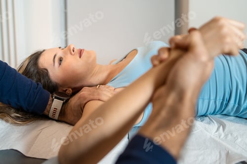 Preview: Osteopath Treating Woman's Arm