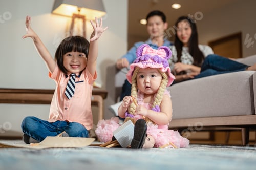 Preview: Brother was playing with his sister.He raised his hand and laughed at the little sister
