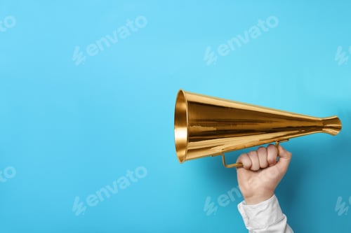 Preview: Man holding megaphone on color background