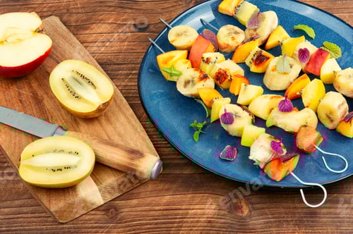 Preview: Fresh Fruit Skewers on a Blue Plate