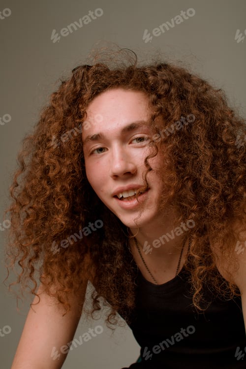 Preview: Attractive And Stylish Guy With Curly Hair And A Sports Figure