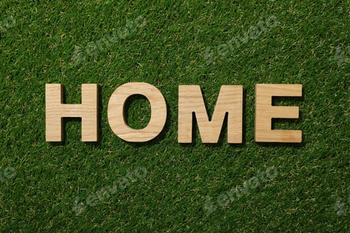 Preview: The word home in wooden letters on green grass