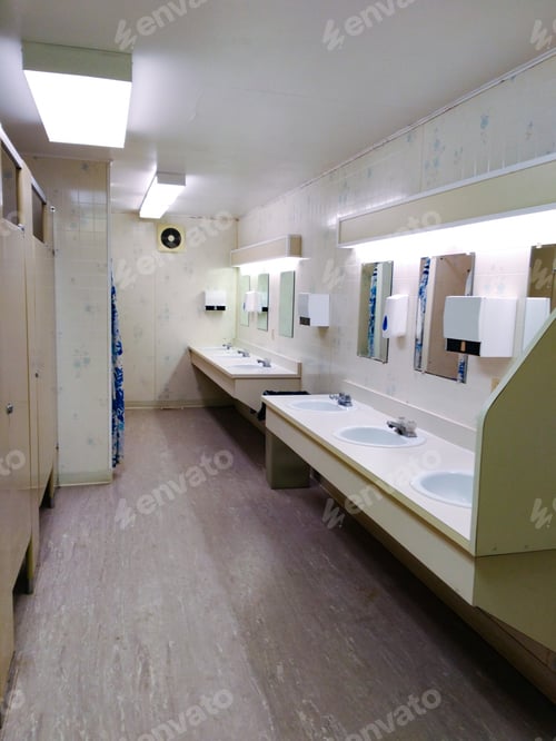 Preview: Modern public restroom with white interior and mirrors with sinks