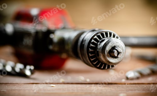 Preview: Close-up of a Drill Bit on Wood Surface
