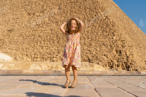Preview: Cute little girl dancing in front of the Cheops pyramid on the Giza plateau