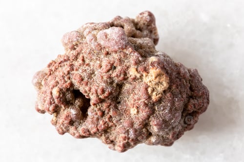 Preview: sample of raw chalcedony mineral on white marble