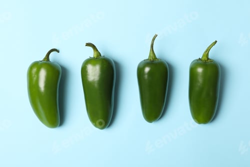 Preview: Fresh green pepper on blue background, space for text