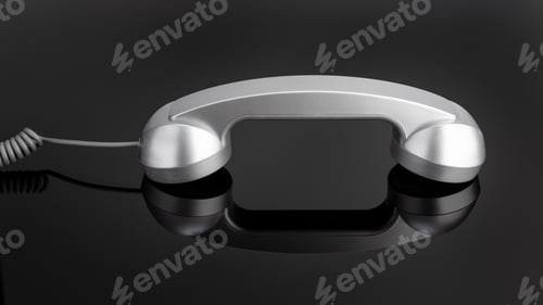 Preview: Retro telephone handset on black background