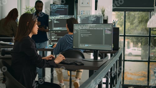 Preview: Asian software engineer working with user interface on computer screen