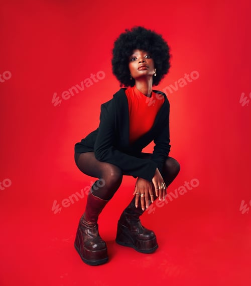 Preview: Black woman, makeup and afro, hair and fashion in portrait with shine isolated on red background. H