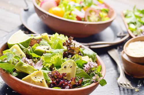 Preview: Clay dish with salad of avocado, green and violet lettuce, lamb'