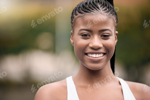 Preview: Closeup on the face of a beautiful tennis player. Young african american girl about to play tennis.