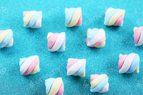 Preview: Marshmallow Christmas candy closeup on glitter blue background