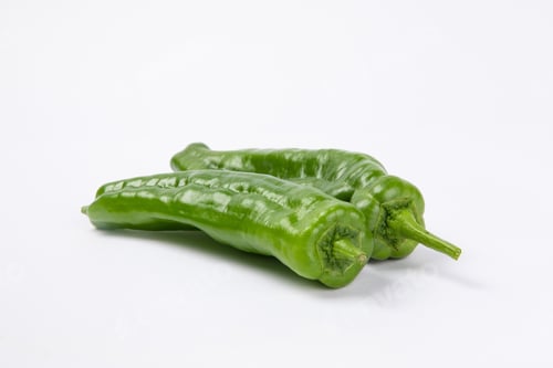 Preview: Closeup shot of green peppers isolated on white background