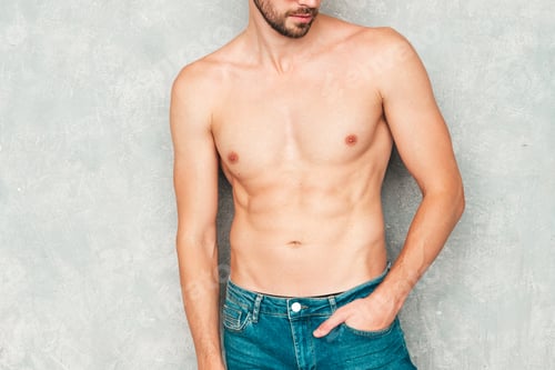 Preview: Portrait of young handsome man posing in studio