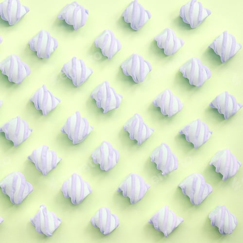Preview: Colorful marshmallow laid out on lime paper background. pastel creative textured pattern