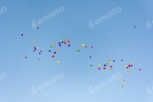 Preview: Colorful balloons in the blue sky fly away into the distance.