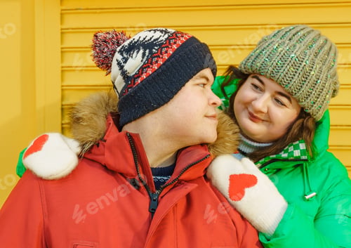 Preview: Winter plus size couple lovestory. Happy smiling man, body positive woman outdoors in bright warm