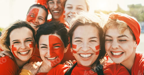 Preview: Crazy sport fans smiling on camera while supporting their team
