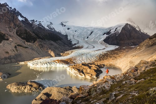 Preview: Male hiker looking out over Torre glacier and laguna in Los Glaciares National Park, Patagonia,