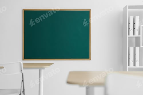 Preview: Blank green chalkboard, desks, chairs and shelving unit in classroom