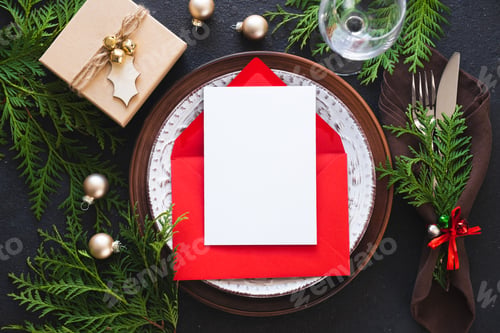 Preview: Christmas table setting with mockup of greeting card or invitation.