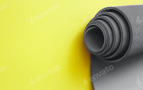 Preview: Ultimate gray yoga mat on a illuminating background