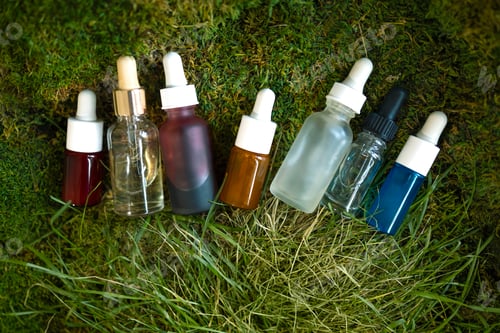 Preview: Cosmetics, skin care, beauty, body treatment concept. Essential oils with drops pipette
