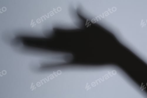 Preview: Shadow of hand like dog on grey background