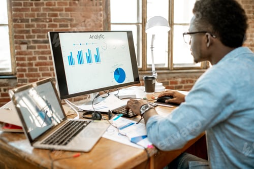 Preview: Man working with analytics at the office