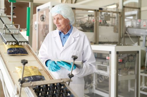 Preview: Senior Woman at Packaging Line