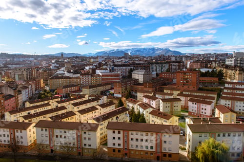 Preview: Modern buildings in city near mountains