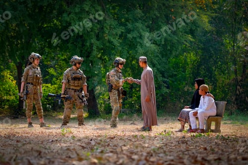 Preview: Muslim man shake hand with soldier man and his family stay near to him