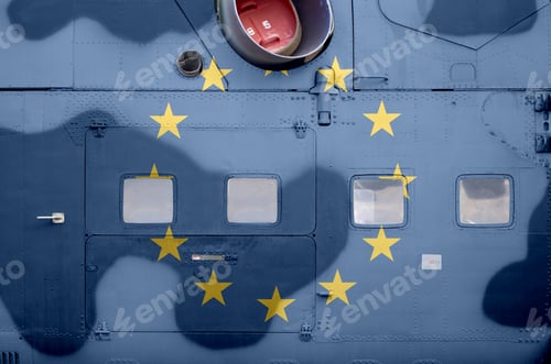 Preview: European union flag depicted on side part of military armored helicopter close up