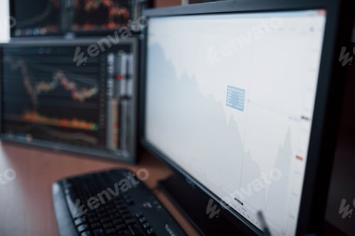 Preview: Analyzing data. Close-up of young businessman pointing on the data presented in the chart with pen
