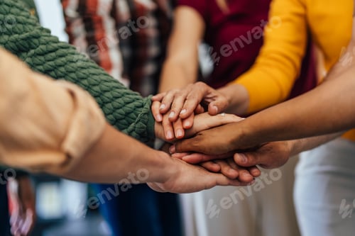 Preview: Team of Individuals Joining Hands in Unity and Collaboration