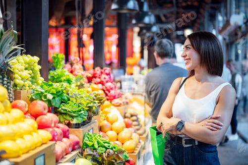 Preview: Woman shopping for fresh produce at local market