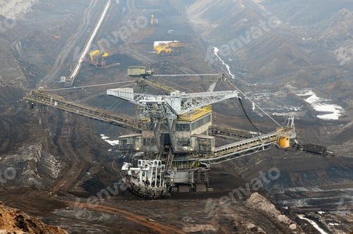 Preview: aerial view in coal mine with bucket wheel excavator. destruction of nature. fossil energy.