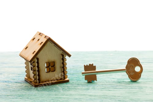 Preview: toy wooden model house as symbol family and love concept on sunny