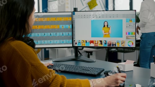 Preview: Woman designer, photo editor specialist working at pc