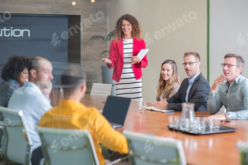Preview: Businesswoman leading a meeting in boardroom