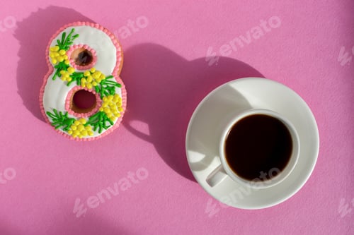 Preview: March 8 cake and coffee mug on a bright pink background.
